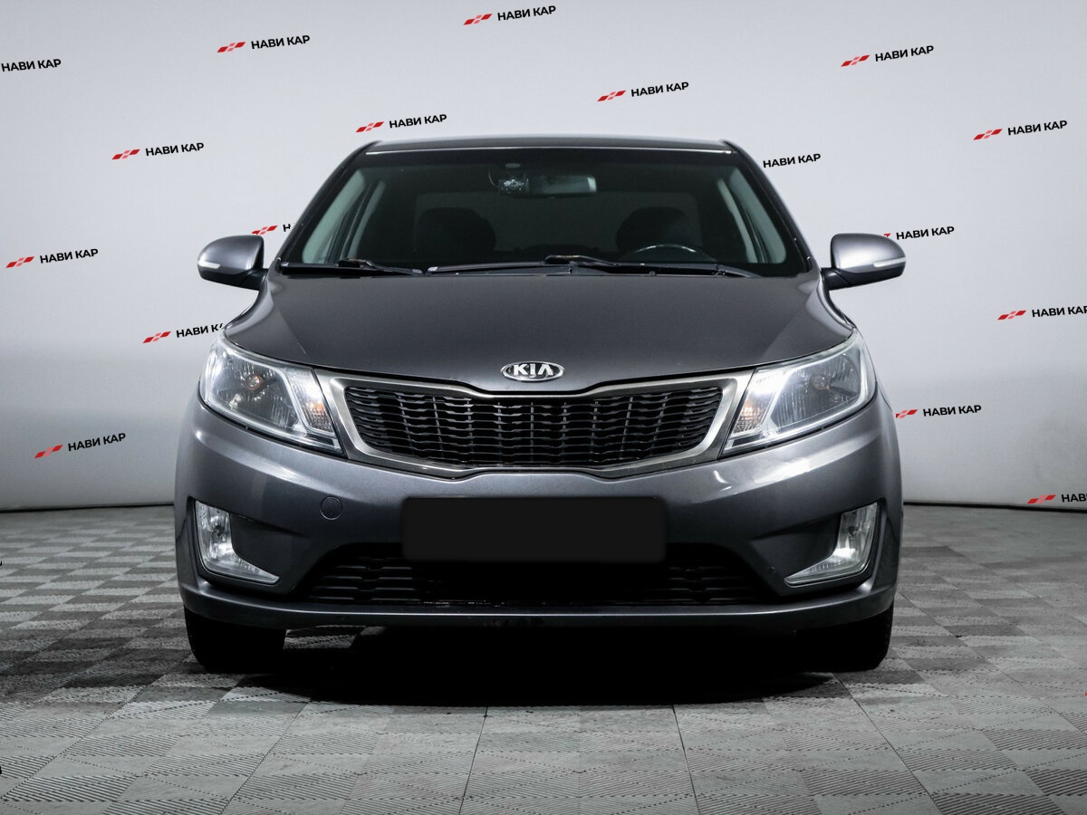 Kia Rio с пробегом — 2013 год. Фото: #1